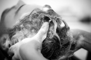 Man having hair washed